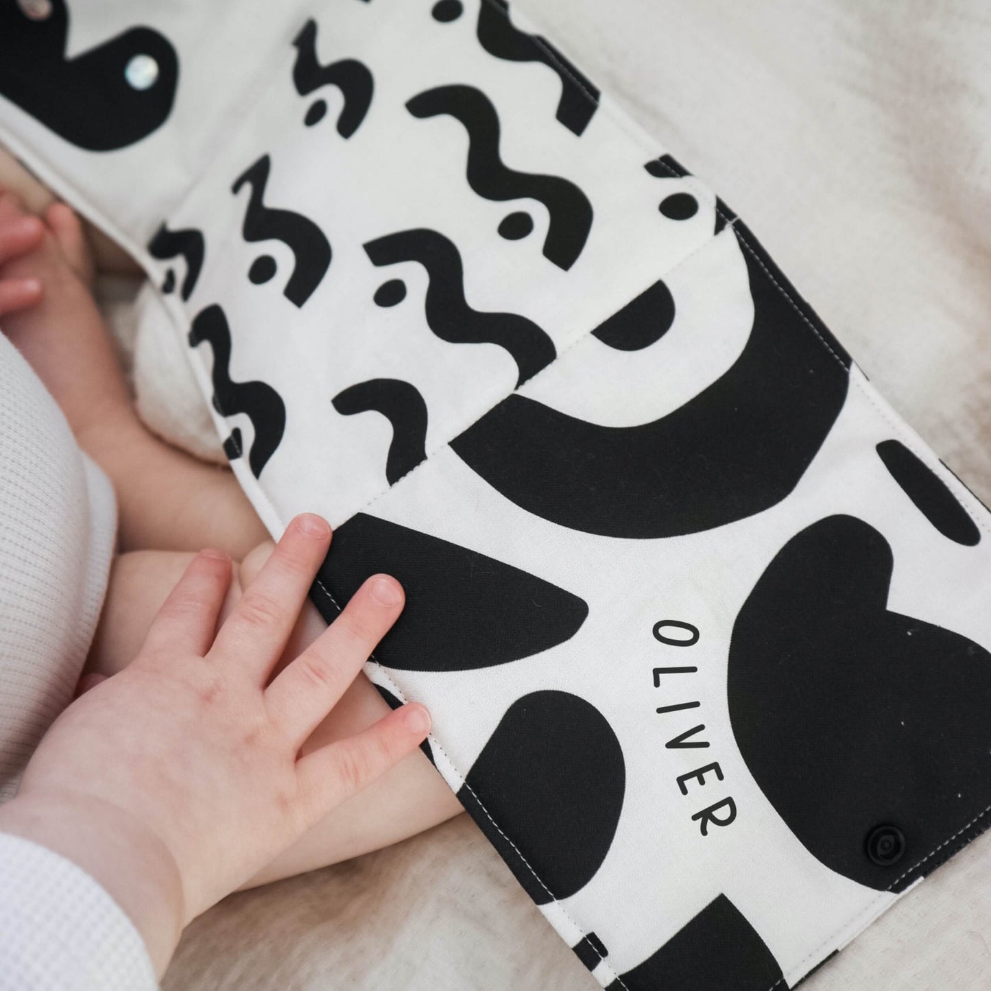Personalised fold-out tummy time sensory book